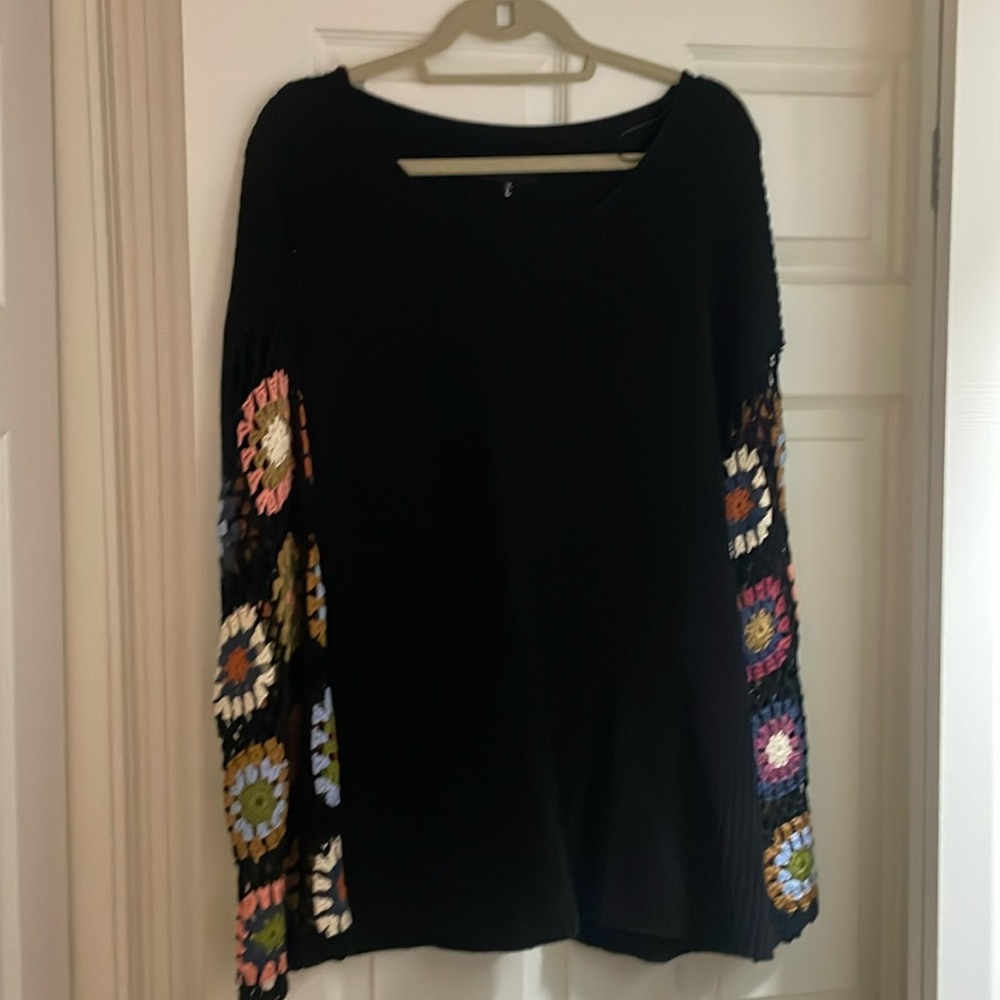 Black sweater with crochet sleeves